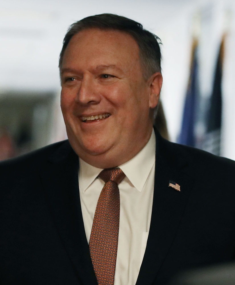 CIA Director Mike Pompeo smiles as he walks to a meeting with Sen. Mark Warner (D-VA) on Capitol Hill in Washington in this April 18, 2018 file photo. — AFP