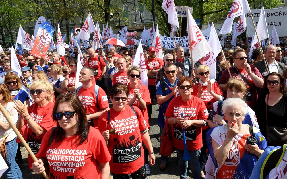 Teachers take part in a demonstration to demand wage hikes in Warsaw on Saturday. — AFP