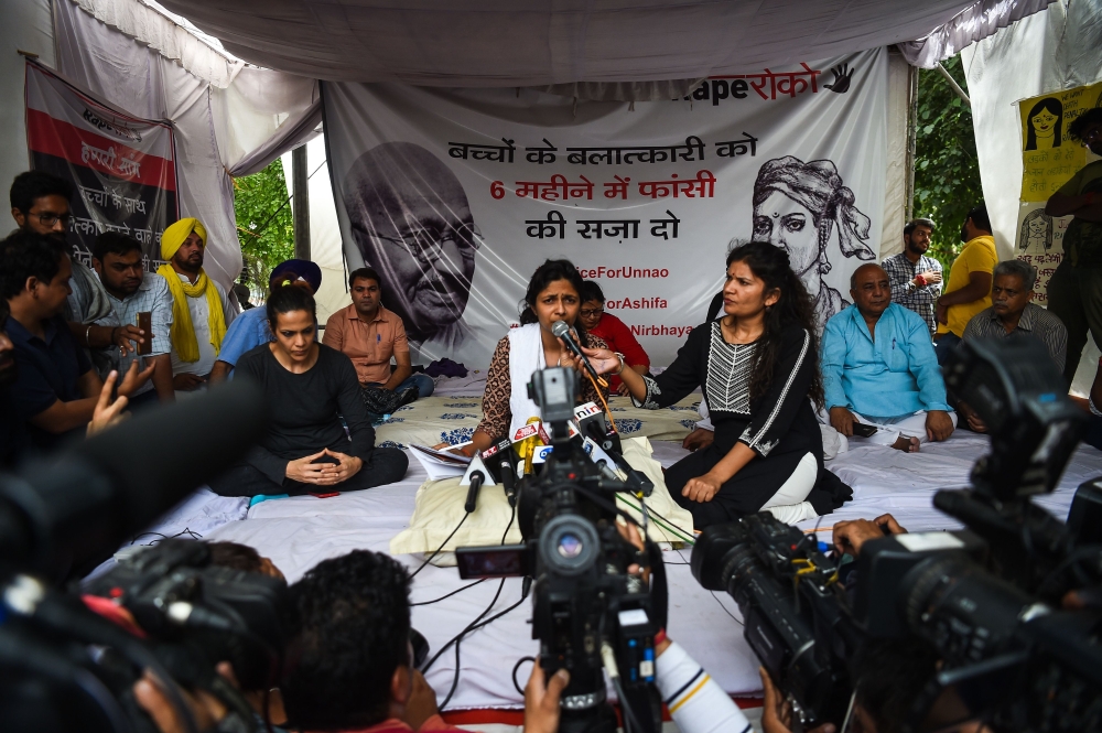 Swati Maliwal, chairperson of the Delhi Commission for Women, speaks to the media in New Delhi on Saturday during her hunger strike protest in which she is demanding the immediate implementation of a stringent law to punish convicted rapists. — AFP