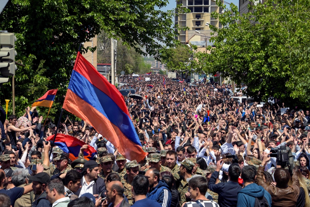 Demonstrators march through the streets of Yerevan on Monday, to protest the former president’s election as prime minister. — AFP