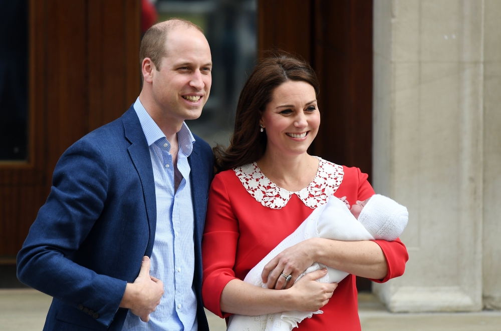 Britain's Prince William, Duke of Cambridge, stands next to his wife Kate, Duchess of Cambridge, as she holds their newborn son outside the Lindo Wing at St. Mary's Hospital in Paddington, London on Tuesday. - EPA