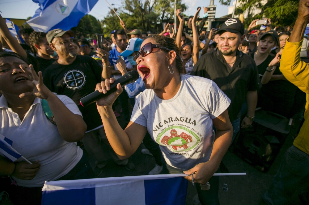Hundreds of people attend a demonstration held to protest against the government of President Daniel Ortega, in Managua, Nicaragua, on Monday. — EPA