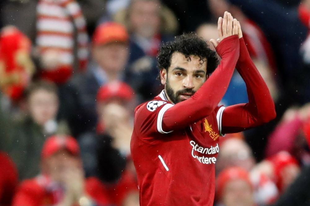 Liverpool’s Mohamed Salah celebrates scoring their first goal during their Champions League semifinal first leg against AS Roma in Liverpool Tuesday. — Reuters
