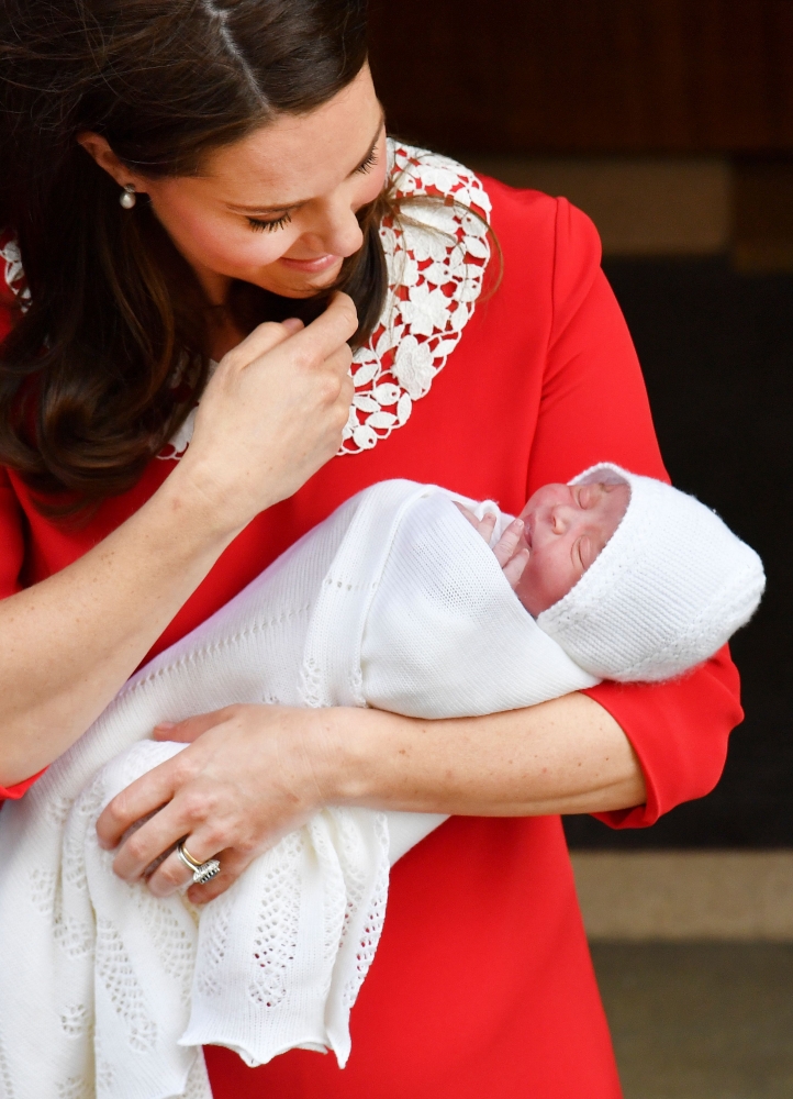 In this April 23, 2018 file photo, Britain's Kate, Duchess of Cambridge, holds her newly-born son, Prince Louis of Cambridge, as she shows him to the media outside the Lindo Wing at St Mary's Hospital in central London. - AFP