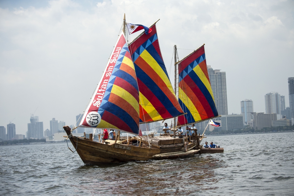 A traditional Philippine wooden boat known as “balangay” sets sail from Manila to China on Saturday. — AFP