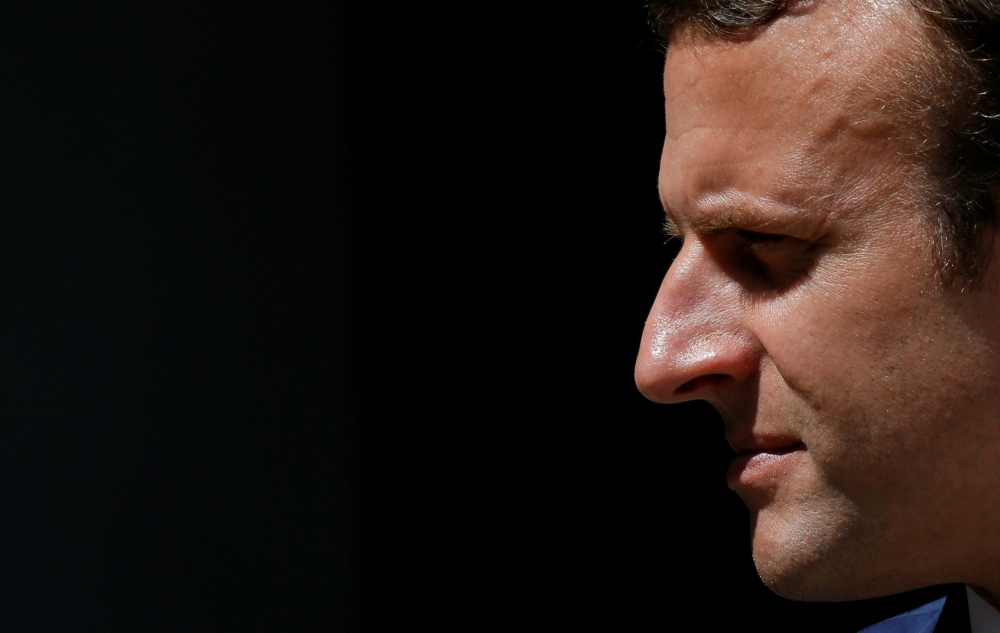 French President Emmanuel Macron (center) walks with President of the 'Senat Coutumier' Pascal Sihaze (center/right) French Foreign Affairs Minister Jean-Yves Le Drian (2nd left), High Commissioner in New Caledonia Thierry Lataste (rear) and others as he arrives to attend a welcoming ceremony at The Coutumier Senate in Noumea, Thursday. Macron's plane landed in Noumea, New Caledonia, for the second leg of the president's trip to the Pacific, six months before the referendum on the independence of the island. — AFP