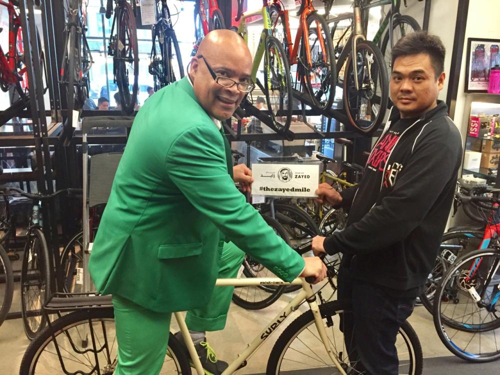 Don Victor Mooney with an employee at NYC Velo bike store in New York City. — Courtesy photo