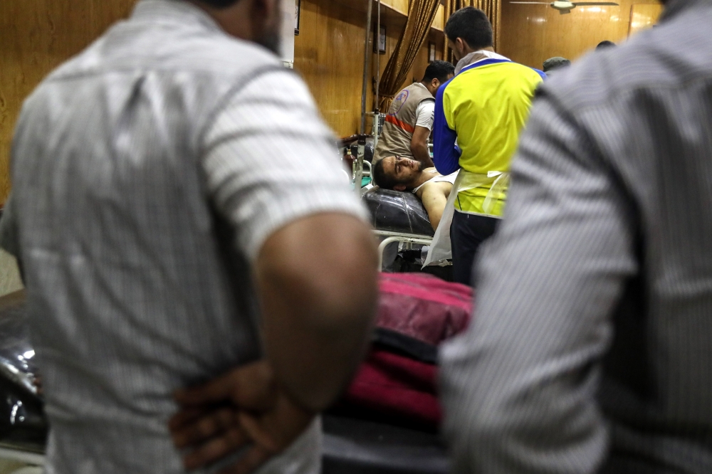 Injured people receive treatment in a hospital in Idlib city, Syria. At least nine people were killed in Idlib after an explosion. The cause of the explosion has not been confirmed. — EPA