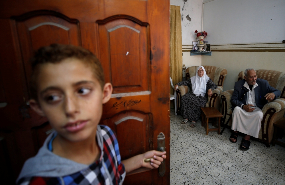 Palestinian refugees Saber Deeb and his wife Huda at their house in Gaza City. — Reuters
