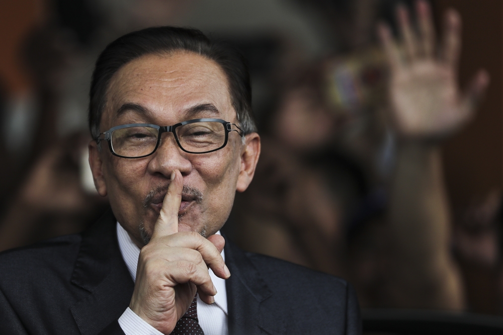 Malaysian opposition leader Anwar Ibrahim reacts as he leaves a rehabilitation center in Kuala Lumpur, Malaysia, on Wednesday. — EPA