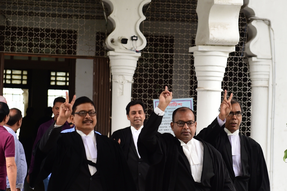 Lawyers representing the Bangladesh Nationalist Party (BNP) celebrate after the Supreme Court upheld a lower court’s decision to grant opposition leader Khaleda Zia bail in Dhaka on Wednesday. — AFP