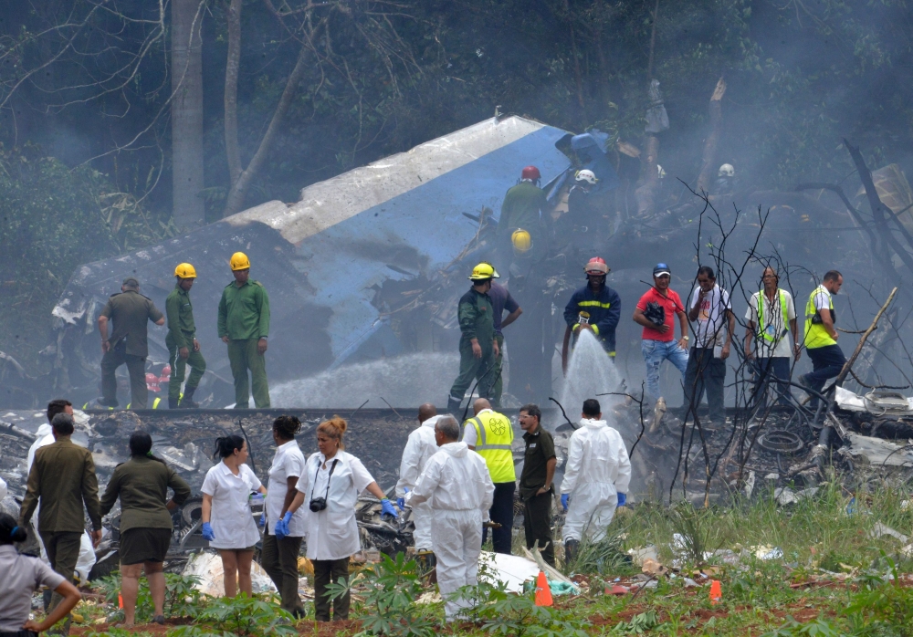 Picture taken at the scene of the accident after a Cubana de Aviacion aircraft crashed after taking off from Havana's Jose Marti airport on Friday. A Cuban state airways passenger plane with 104 passengers on board crashed on shortly after taking off from Havana's airport, state media reported. — AFP