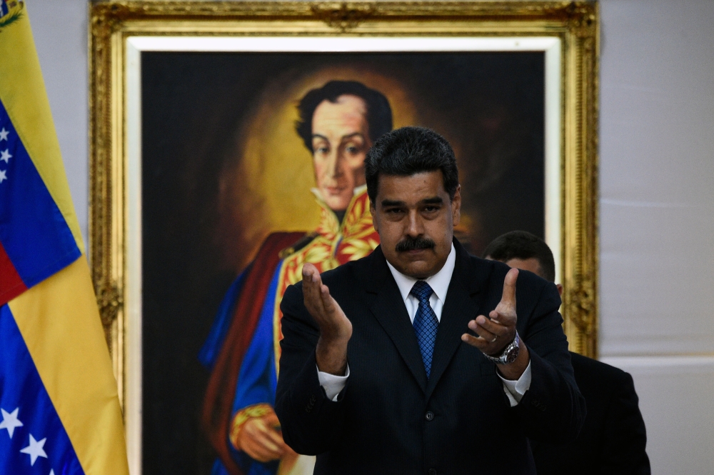 Venezuelan President Nicolas Maduro gestures during a meeting with the international observers for the upcoming May 20 election at the Miraflores presidential palace in Caracas on Friday. — AFP