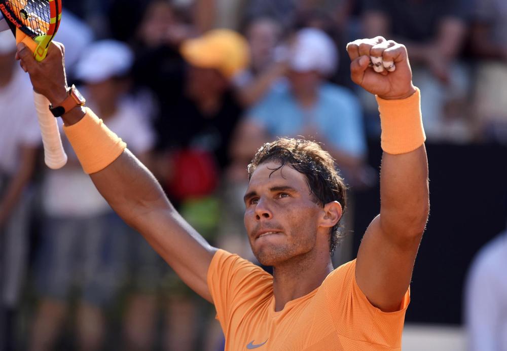 Spain's Rafael Nadal celebrates after defeating Serbia's Novak Djokovic in the semifinal match at the Italian Open tennis Tournament in Rome Saturday. — EPA