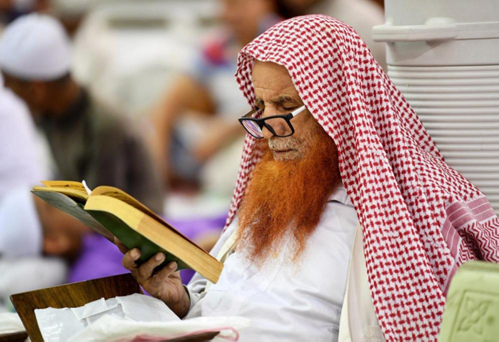 Engrossed in reading the Holy Qur’an