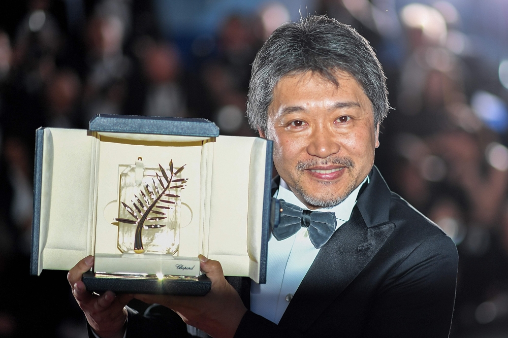 US director Spike Lee poses with his trophy after he won the Grand Prix for the film 