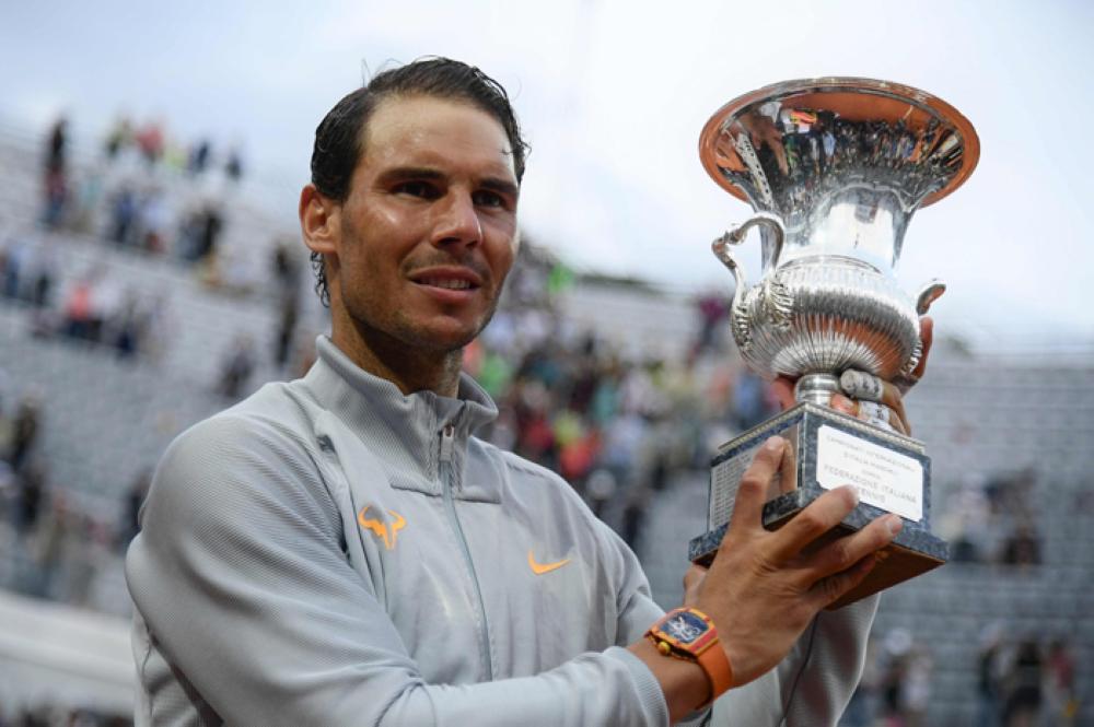 Spain's Rafael Nadal poses with the trophy after winning the Men's final against Germany's Alexander Zverev at Rome's ATP Tennis Open tournament at the Foro Italico, on Sunday in Rome. — AFP