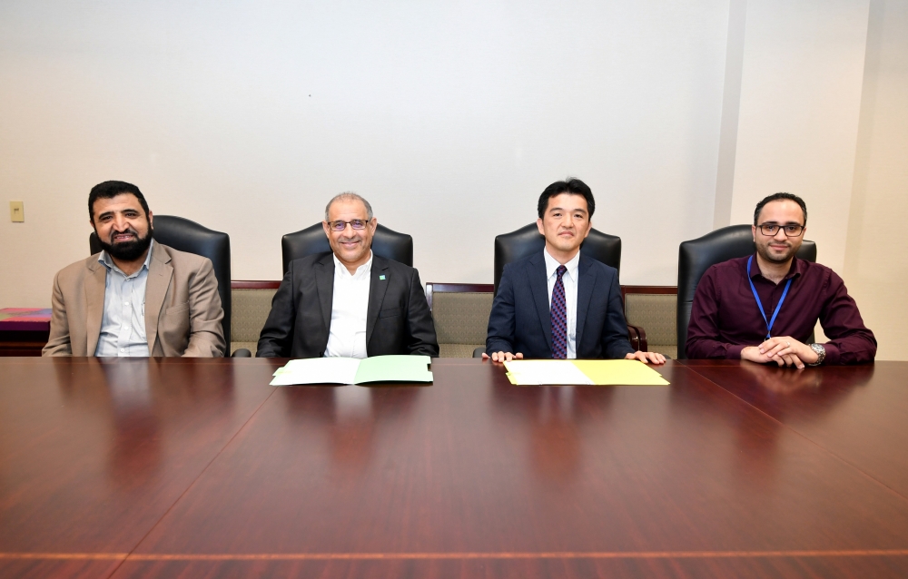 Fahad Helal, VP of project management, Saudi Aramco (2nd from left), with Hiroshi Katayanagi, executive director, Networks & System Integration Saudi Arabia Co. Ltd. (2nd from right) at the signing ceremony. — Courtesy photo