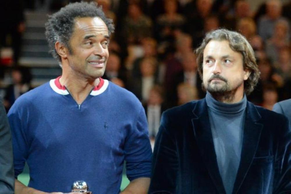 File photo shows French tennis greats Yannick Noah and Henri Leconte, right.