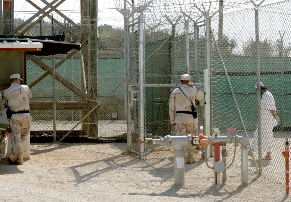 A prisoner being taken for questioning in Guantanamo prison.