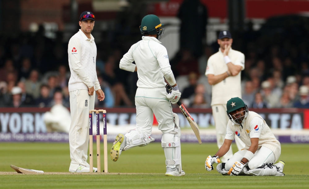 Pakistan's Babar Azam reacts after being hit by a ball by England's Ben Stokes during the second day of the first Test at the Lord's Cricket Ground, London. — Reuters