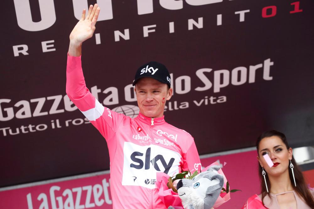 British rider Christopher Froome wearing the pick jersey celebrates on the podium after the 20th stage from Susa to Breuil-Cervinia of the 101th Giro d'Italia, Tour of Italy, in Cervinia, Italy, Saturday. — AFP