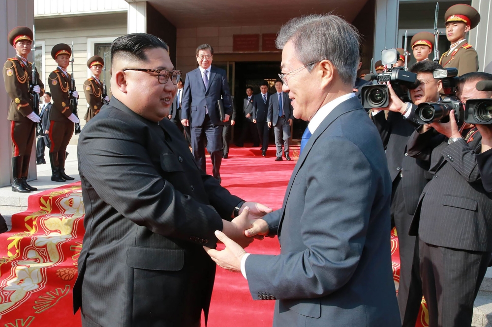This photograph taken on Saturday and released on Sunday shows South Korea’s President Moon Jae-in, right, shaking hands with North Korea’s leader Kim Jong Un after their second summit at the north side of the truce village of Panmunjom in the Demilitarized Zone (DMZ). — AFP