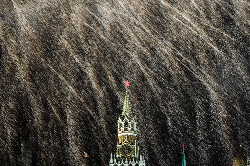 A picture taken early on January 1, 2018, shows fireworks lighting the sky over the Spasskaya tower with a red star during the New Year celebrations in central Moscow. World football's governing body FIFA admitted on Monday it will have to redo a TV ad for the Russia World Cup because it had put a cross instead of a red star on the Kremlin’s Spasskaya Tower by mistake. — AFP 