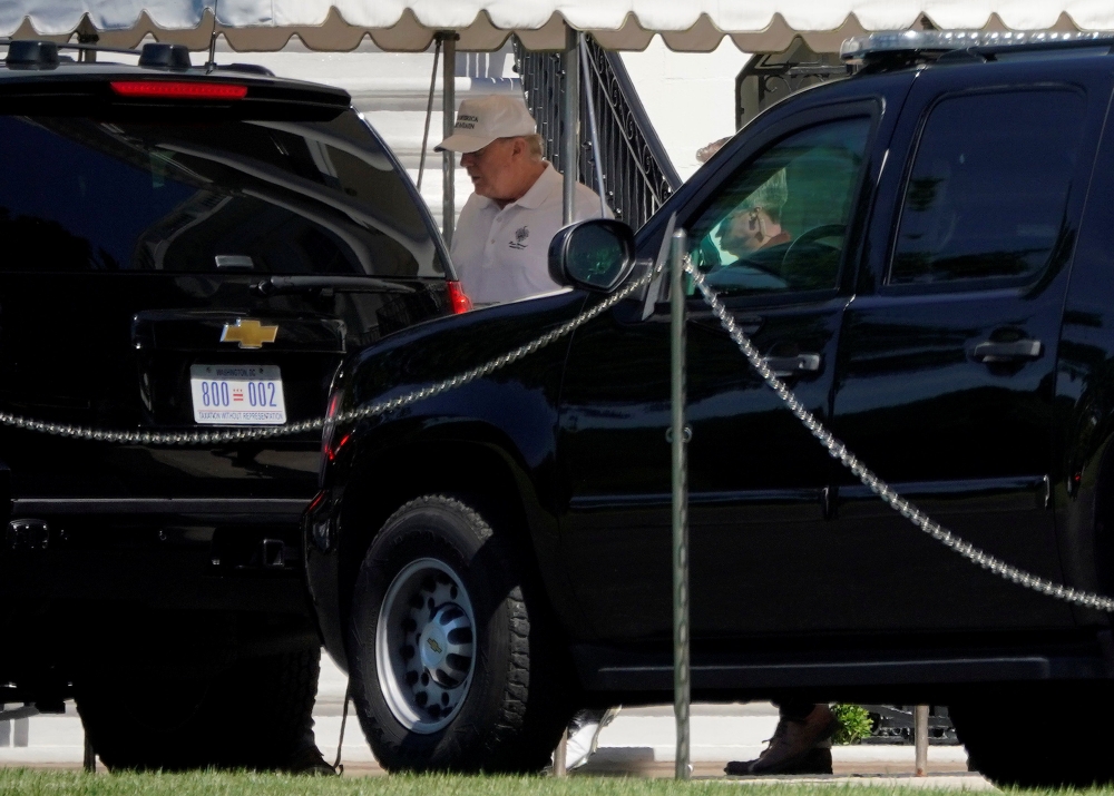 US President Donald Trump walks to a vehicle before departing for the Trump National Golf Course from the White House in Washington, US, on Saturday. — Reuters