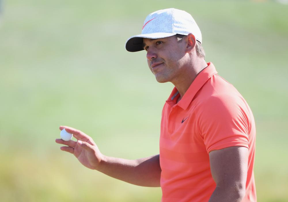 Brooks Koepka of the United States waves after making a birdie on the ninth hole during the third round of the 2018 US Open at Shinnecock Hills Golf Club in Southampton, New York, Saturday.  — AFP