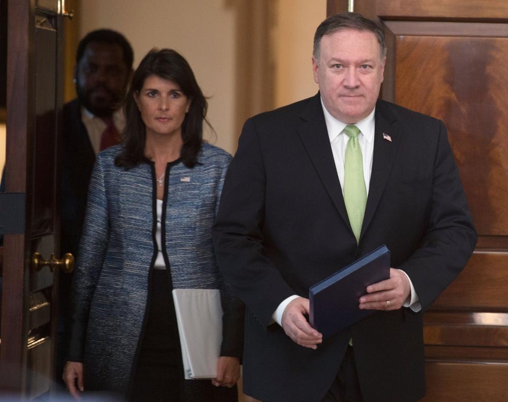 
US Secretary of State Mike Pompeo and US Ambassador to the United Nation Nikki Haley arrive at a press conference at the US Department of State in Washington DC on June 19, 2018. — AFP