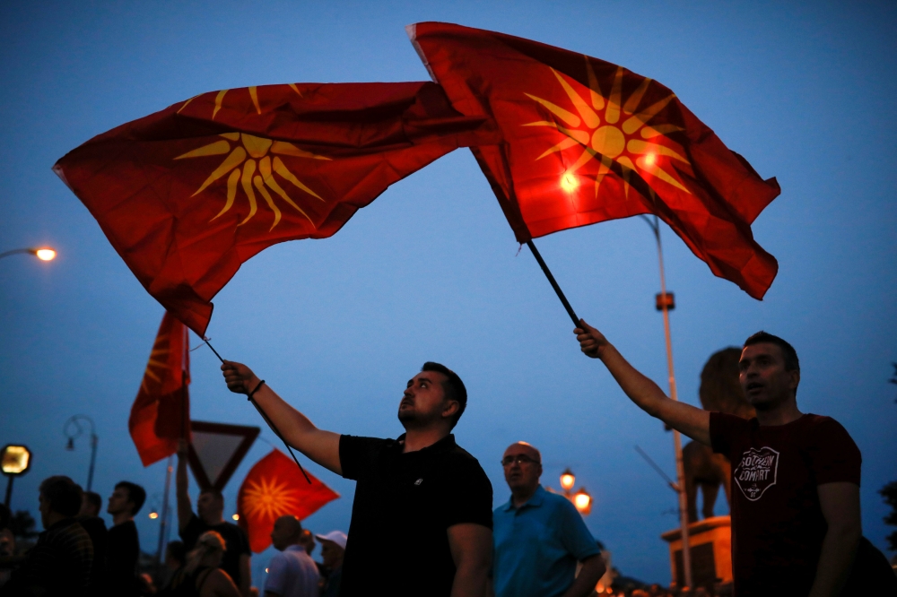 Supporters of opposition party VMRO-DPMNE wave Macedonian flags as they take part in a protest over compromise solution in Macedonia’s dispute with Greece over the country’s name in Skopje, Macedonia, in this June 2, 2018 file photo. — Reuters