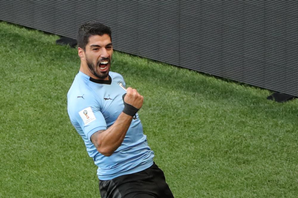 Uruguay's Luis Suarez celebrates scoring against Saudi Arabia Wednesday. — Reuters