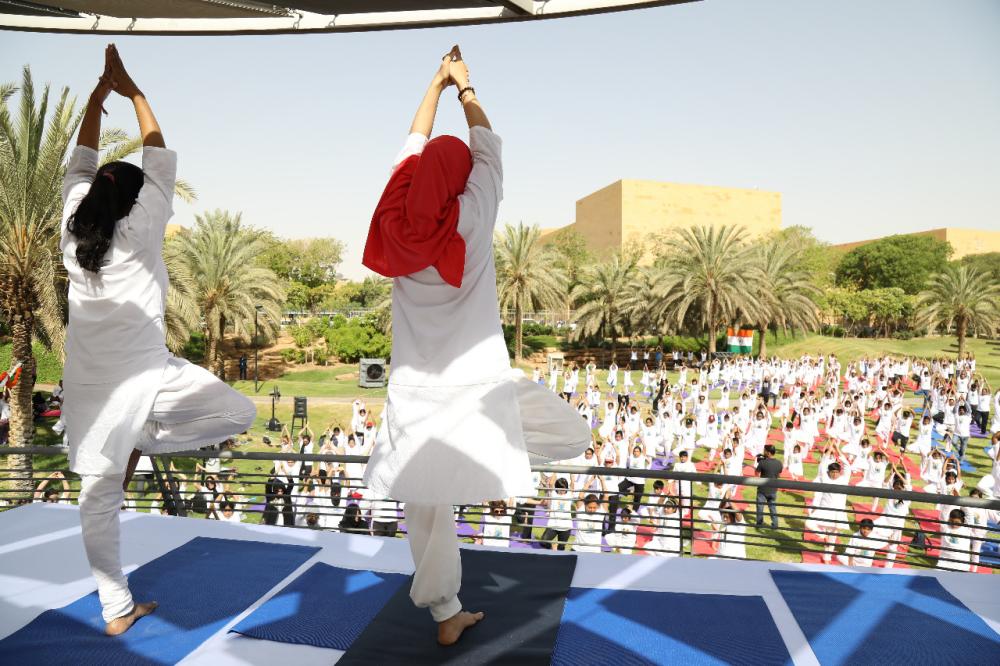 Indian Ambassador Ahmad Javed is seen demonstrating a yoga posture. 