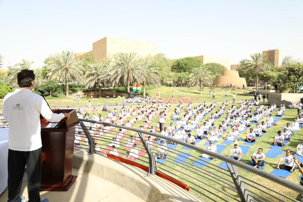 Indian Ambassador Ahmad Javed is seen demonstrating a yoga posture. 