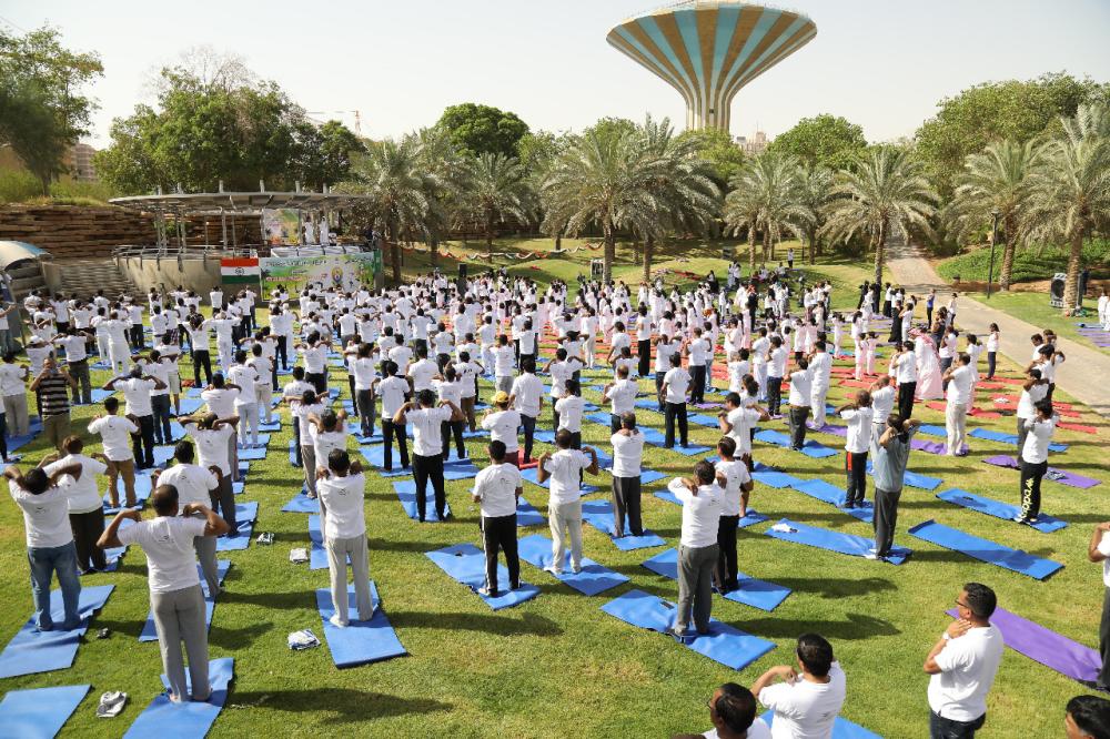 Indian Ambassador Ahmad Javed is seen demonstrating a yoga posture. 