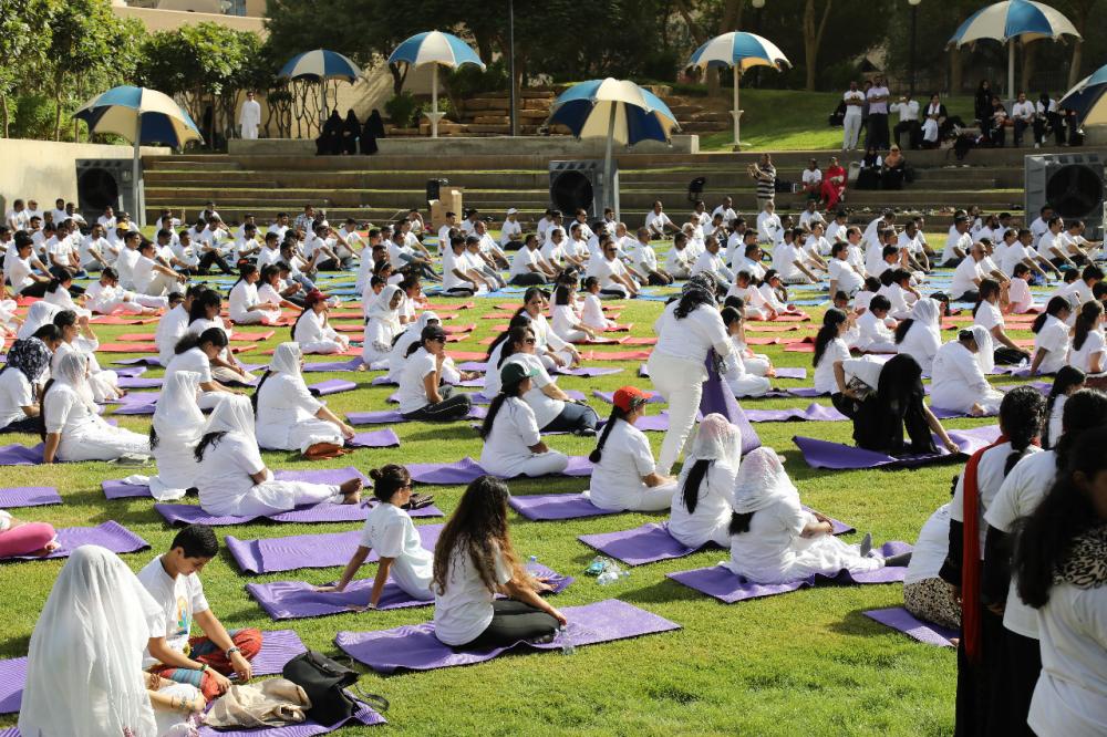 Indian Ambassador Ahmad Javed is seen demonstrating a yoga posture. 