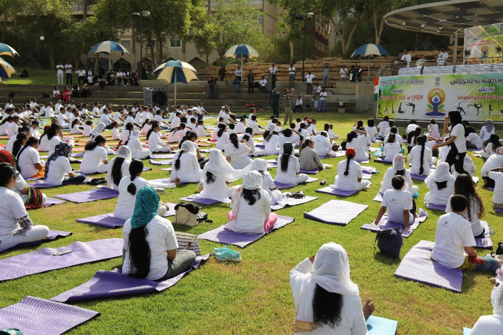 Indian Ambassador Ahmad Javed is seen demonstrating a yoga posture. 