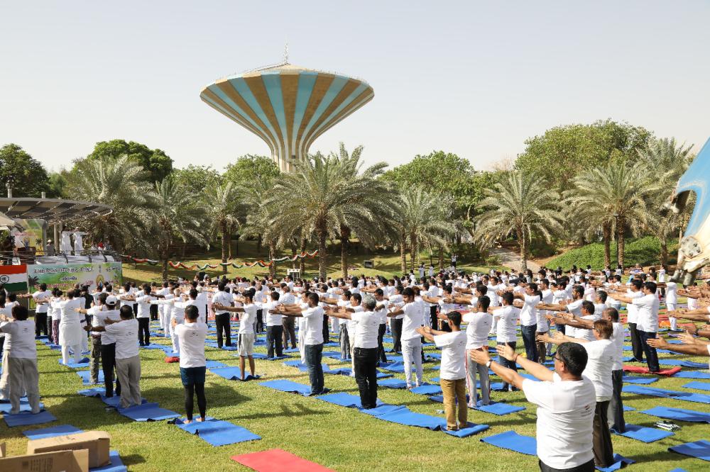 Indian Ambassador Ahmad Javed is seen demonstrating a yoga posture. 