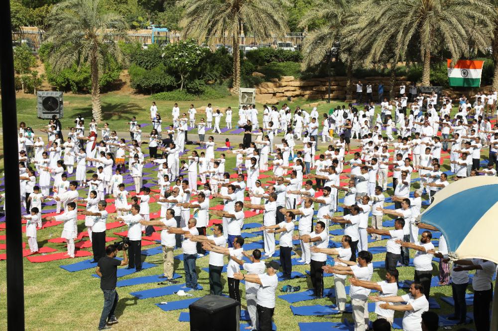 Indian Ambassador Ahmad Javed is seen demonstrating a yoga posture. 