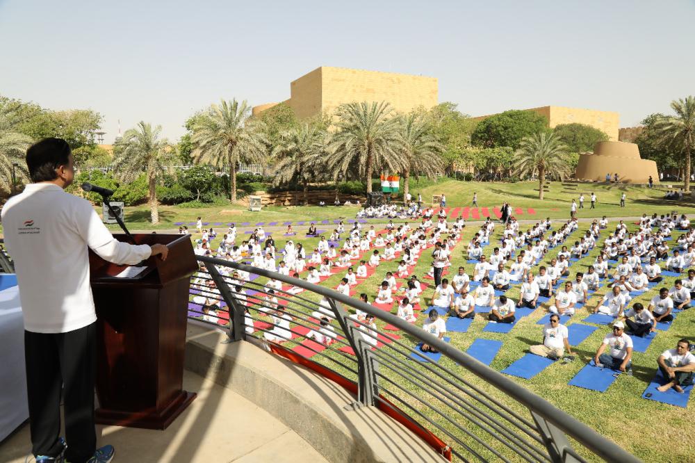 Indian Ambassador Ahmad Javed is seen demonstrating a yoga posture. 