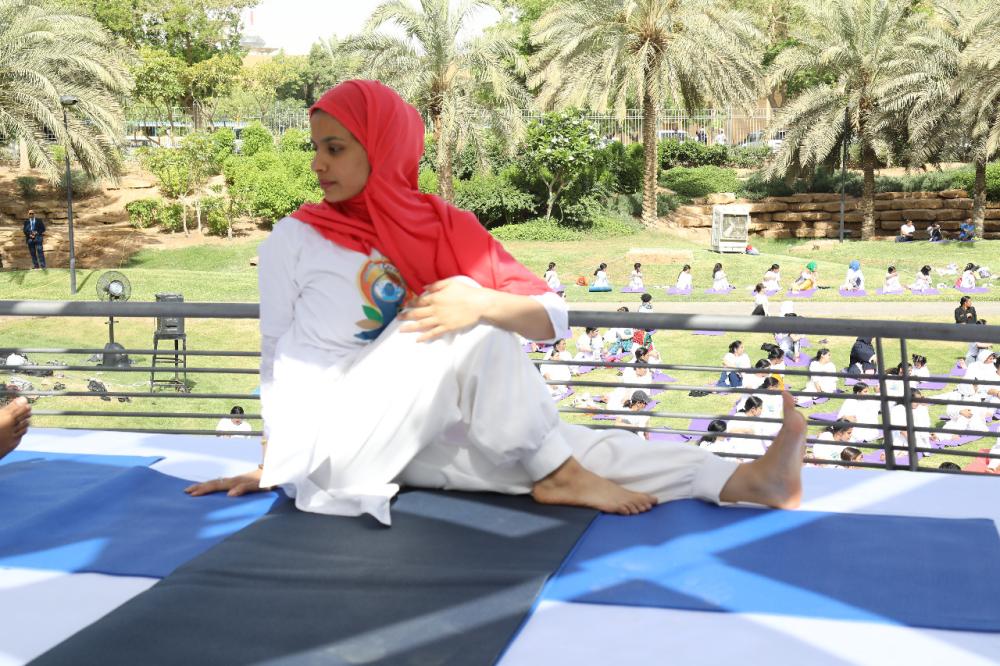 Indian Ambassador Ahmad Javed is seen demonstrating a yoga posture. 