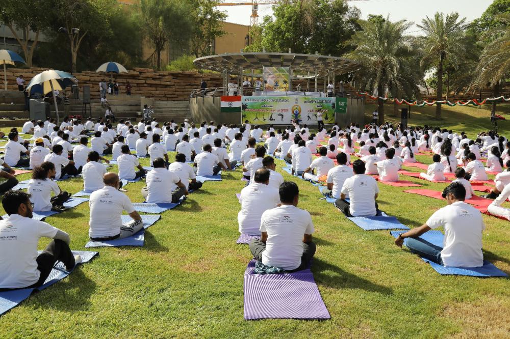 Indian Ambassador Ahmad Javed is seen demonstrating a yoga posture. 