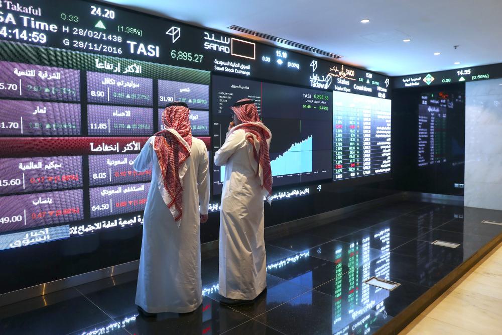 A screen gives the latest share prices on the Saudi Arabia stock exchange, also known as the Tadawul All Share Index in Riyadh. “The inclusion of Saudi stocks in the MSCI Emerging Markets Index will facilitate investors’ accessibility to the local stock market and will attract foreign investments into the Kingdom. — Courtesy photo