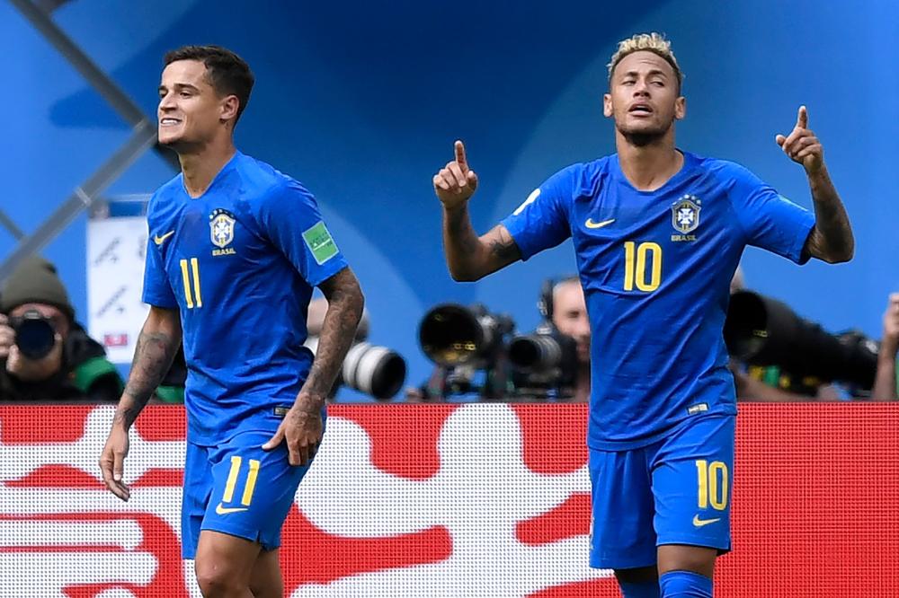 Brazil’s Neymar (R) celebrates a goal beside teammate Philippe Coutinho during their World Cup match against Costa Rica at the Saint Petersburg Stadium Friday. — AFP 