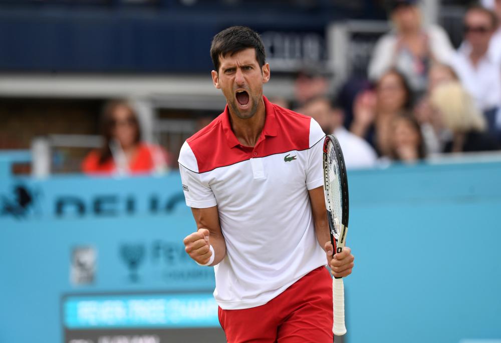 Serbia's Novak Djokovic reacts during his semifinal match against France's Jeremy Chardy at the Queen's Tennis Tournament in London Saturday. — Reuters