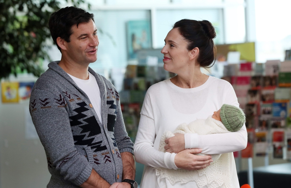New Zealand Prime Minister Jacinda Ardern and partner Clarke Gayford pose with their baby daughter Neve Te Aroha Ardern Gayford outside the hospital in Auckland on Sunday. — AFP