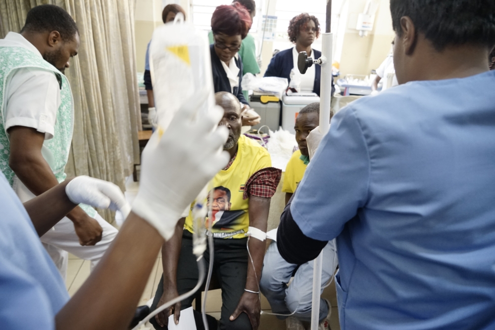 Staff attend to injured ZANU-PF supporter at Mpilo hospital in Bulawayo, after a bomb blast at a campaign rally at White City stadium, on Saturday. — AFP