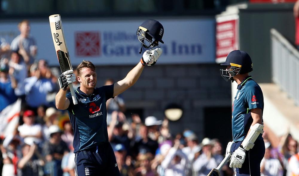England's Jos Buttler celebrates after reaching a century against Australia in the fifth One-Day International at Emirates Old Trafford, Manchester, Sunday. — Reuters