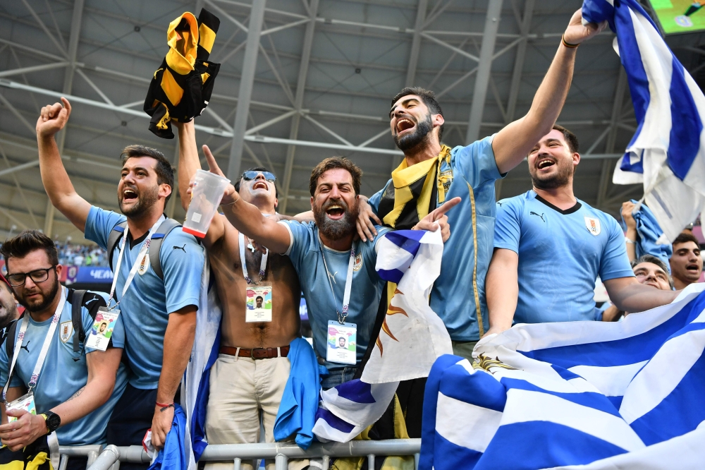 Uruguay fans celebrate at the end of the Russia 2018 World Cup Group A football match between Uruguay and Russia at the Samara Arena in Samara on Monday. — AFP
